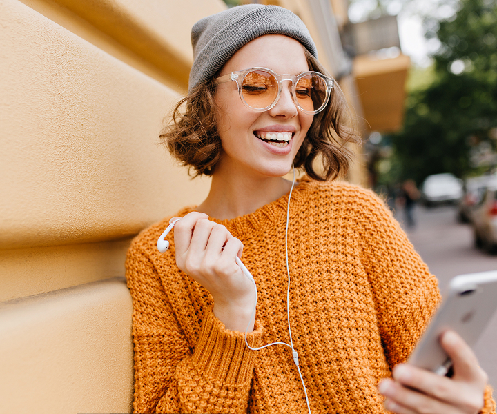 photo of a woman holding a phone